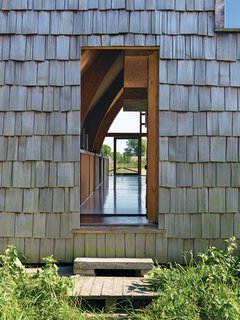 The front door dissolves into the facade.