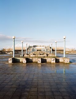 An expansive plaza leads to the entryway of the harborside Linnahall, a bulky, symmetrical concrete-and-stone concert hall.