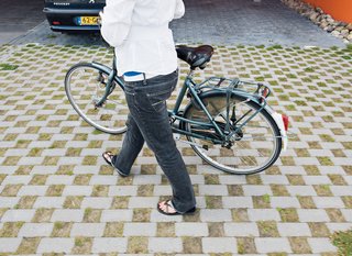 Nineteen-year-old Yvette Sweringa arrives at the villa by bike.