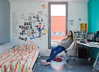 Thijske Noordhoek relaxes in her study-cum-bedroom.