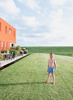 Five-year-old Thomas Dochter plays outside the houses.