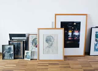 Van Dijk's framed pictures stacked on the floor form an impromptu point of visual interest.
