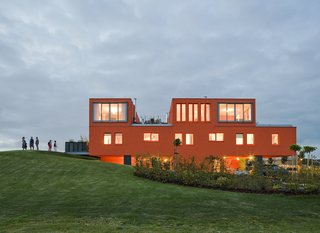 Villa Van Vijven cuts a truly remarkable figure, a striking orange figure on the otherwise flat green landscape.