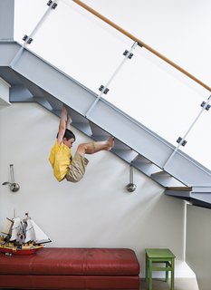 From the second level of the house, Griffin climbs the stairs his own way.