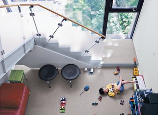 The kids play in the family room just beneath the stairs.