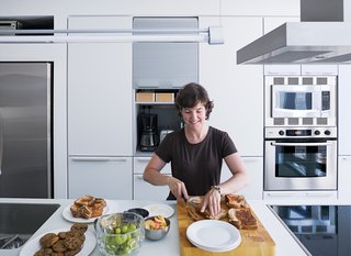 A white Bulthaup system fits cleanly into the 13-foot-long kitchen.