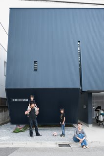 The black facade of the Yatabes’ house may turn a darkly futuristic face to its suburban block, but behind it the house is full of light. In Saitama, a tightly packed neighborhood near Tokyo, the black metal screen affords the family privacy without sacrificing outdoor space.