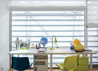 A pint-size "work-station" for the boys on the third floor overlooks the garden.
