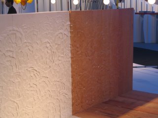 The headboard of the bed by Peter Marigold shows his flowery visual signature.
