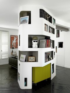 A puzzle of MDF and plywood created built-in shelving on almost every wall, which was then intensively finished with laminates and paints.