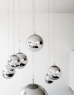 Composite Index - Photo 7 of 10 - Bruce worried about what to put in the double-height space above the kitchen table—–until he found these Tom Dixon–designed mirror balls. "They were installed at random and when William came over that evening, he said, ‘Fantastic, well done.’ So we left them like that."