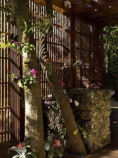 The entry portal Oppenheim designed doubles as a kind of small orchid park.
