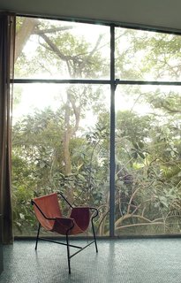 Lina Bo Bardi - Photo 7 of 14 - Bo Bardi designed the Tripé, or Tripod, armchair, around 1948. Made of painted tubular metal and hand-stitched leather and possessing the same design principles as the hammock, several examples existed throughout the Glass House. Photo courtesy Espasso.