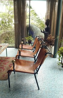 Lina Bo Bardi - Photo 9 of 14 - The leather sling and ball motif of the dining chairs were repeated in other Bo Bardi designs. Photo courtesy Espasso.