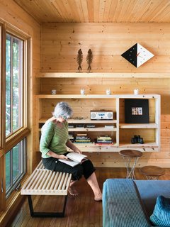 The day-lit corner of the living room creates a nice nook for reading.