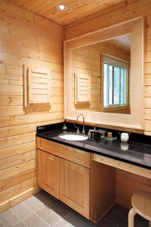 A discreet master bathroom eliminates visual clutter.