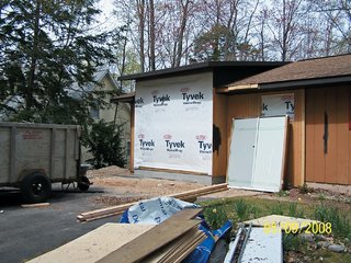 While the general form of the exterior remains the same, a fresh color scheme distinguishes the new house from its former identity.