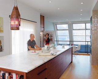 Project Runaway - Photo 3 of 14 - Vintage pendants cast a soft glow over the island, which contains a Bosch dishwasher.