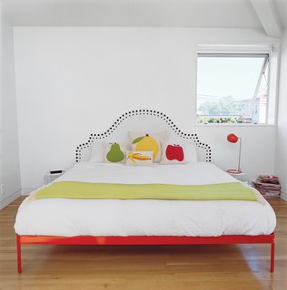 The home already has a vivid color scheme, but to energize certain areas further, Bestor and Grunbaum added murals to some of the walls. Aside from the vinyl decals in the bathrooms, the stairwell is painted to evoke Grunbaum’s family home in the 1970s. Designer Mina Javid created a faux headboard for the master bedroom. minajavid.com
