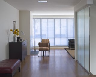 Here you get a pretty clear idea of how much light Overway gets in his living room. Raise the blinds and thank heavens you're a couple floors up, because the views of the northern slopes of Pacific Heights are splendid. Photo by Mark Darley.