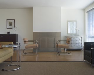 Here is Chad Overway's living room again. The view to the south through the big bank of windows is truly something, and if you poke your head west you'll see the glowing rotunda of the Palace of Fine Arts, a bulbous Neoclassical thing. You can see Overway's love of Le Corbusier's furniture, and overall there are far more nods to 20s and 30s modernism in the house than to the warmer American stuff to come a generation later. Photo by Mark Darley.