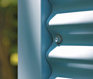 For the exterior and roof, Ewing chose Una-Clad corrugated-steel siding. The material, more commonly found on commercial buildings, is lightweight, durable, easy to maintain, and recyclable.