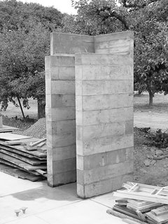 By using the units repeatedly, the architects saved on cost and materials as well as scaling the work to be manageable with one concrete truck and a two-person crew. The resulting facades are textured from the rough wooden planks.