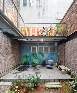 The back garden includes fragments of stone from the earlier building.