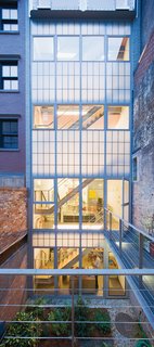 The Weiners put Kalwall translucent panels to good use on the home’s back wall, bringing daylight in without the use of glass windows. Although Kalwall panels can look slightly institutional in cloudy light, the results are often golden, as here.