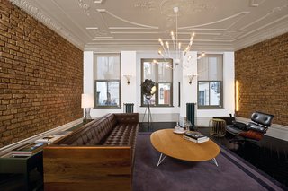 In Özdemir’s living room an Autoban Box sofa faces an Eames 670 lounger, its clear predecessor. Their Octopus chandelier’s lit legs beckon to the ceiling, which boasts a pattern as typical to the city as tiled floor.