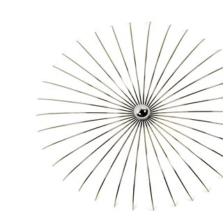 Supported by interior design work, Autoban also designs lighting, seating, and tables that combine classic sensibility with whimsical spontaneity. <br><br>"I found this piece of metal," says Özdemir of the Spider lamp, "and put <br><br>a bulb in the middle. The shadows on the wall were like a spider."