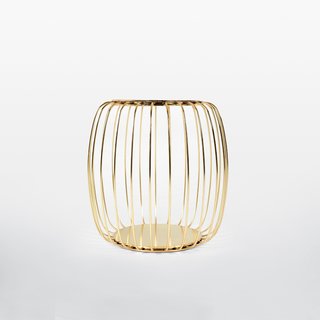 Functioning as a stool, coffee table, and magazine rack, the Pumpkin is a multifunctional design.