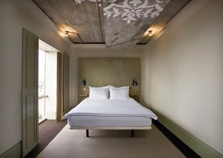 Autoban's redesign of the The Marmara Sisli Hotel included replacing the existing facade, creating an all concrete bar in the lobby, and outfitting every room with a mixture of raw materials.