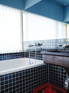 Knotty by Nature - Photo 7 of 25 - The bathroom includes a sink Bornstein discovered in a secondhand store.