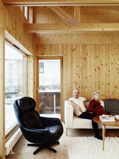 Knotty by Nature - Photo 15 of 25 - Though the view is snowy for much of the year, Bornstein has quite a vista from his living room. The black leather chair is a hand-me-down from his parents.