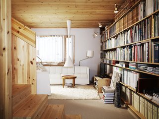 Knotty by Nature - Photo 19 of 25 - Bornstein derives endless inspiration from his massive collection of design books. The clip lamps attached at the top shelf provide an easy, and targeted, lighting scheme.