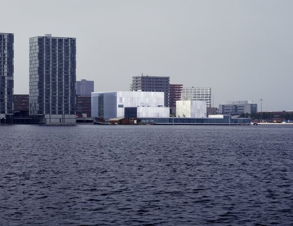 Boxy and defined by just a bit of chromatic variation, the facade of the De Kunstlinie Theater and Cultural Center in Almere, the Netherlands, looks out on the sea.