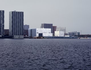 Boxy and defined by just a bit of chromatic variation, the facade of the De Kunstlinie Theater and Cultural Center in Almere, the Netherlands, looks out on the sea.