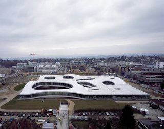 Here is the undulating, topographical form of the Rolex Learning Center in Lausanne, Switzerland. The building opened in 2009 and is the latest addition to the Ecole Polytechnique Federale de Lausanne.