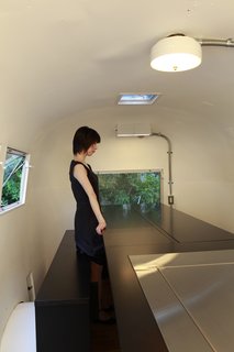 Hide and Sleep - Photo 6 of 10 - When the table isn't filled with food and surrounded by guests, it can transform into two twin beds. Photo by Sadamu Saito.