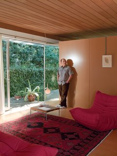 How Good Idea Studio Revamped a 1924 Clapboard House on a $62,000 Budget - Photo 2 of 11 - A sliding glass door and breezy cross ventilation make Louis Molina’s modest living room appear more generous than its actual dimensions.
