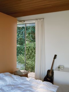 How Good Idea Studio Revamped a 1924 Clapboard House on a $62,000 Budget - Photo 6 of 11 - The bedroom offers just enough space for a bed and nightstand.