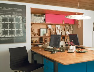 How Good Idea Studio Revamped a 1924 Clapboard House on a $62,000 Budget - Photo 5 of 11 - The architectural office below the living quarters is compact, with just enough space for shared workstations and a bookcase made of plywood and pink Plexiglas.