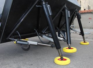 Its body is constructed from a framework of steel plating, wood, and polycarbonate, but can be covered with a combination of materials, perhaps even textiles for insulation or ventilation. Its six spindly appendages are made from steel and mechanical components.