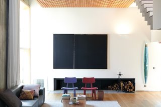 Arco’s Jolly Jubilee chairs, designed by Ineke Hans, give the downstairs living room a shot of color.