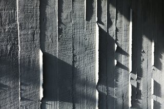 Textured concrete walls are a signature of Cho’s work.
