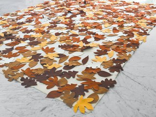 "Normally I’m not that fond of marble," De Waart says, "but in the tropics, it <br><br>really works, because it stays cool." To warm up the space aesthetically, she added rugs throughout the home, including a Turkish goat-hair rug purchased at Ottomania in Haarlem, the Netherlands, and her own Autumn felt rug, which features cut-out felt leaves on a white background.