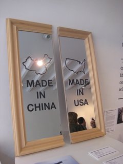 Chi-Merica by Paul Loebach. This mirror represents the divide between American-made products and those produced in China.