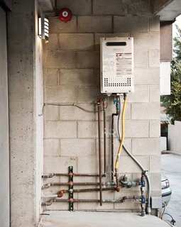 Lucky 7 - Photo 9 of 15 - Just outside their home, residents get to track net energy usage on the solar power meter.