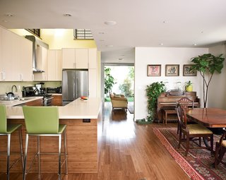 Lucky 7 - Photo 13 of 15 - Developer Michael Kyle and his wife Joanne Higgins mix old and new in their living and kitchen areas.